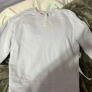 never worn. no stains. oversized fit. light purple